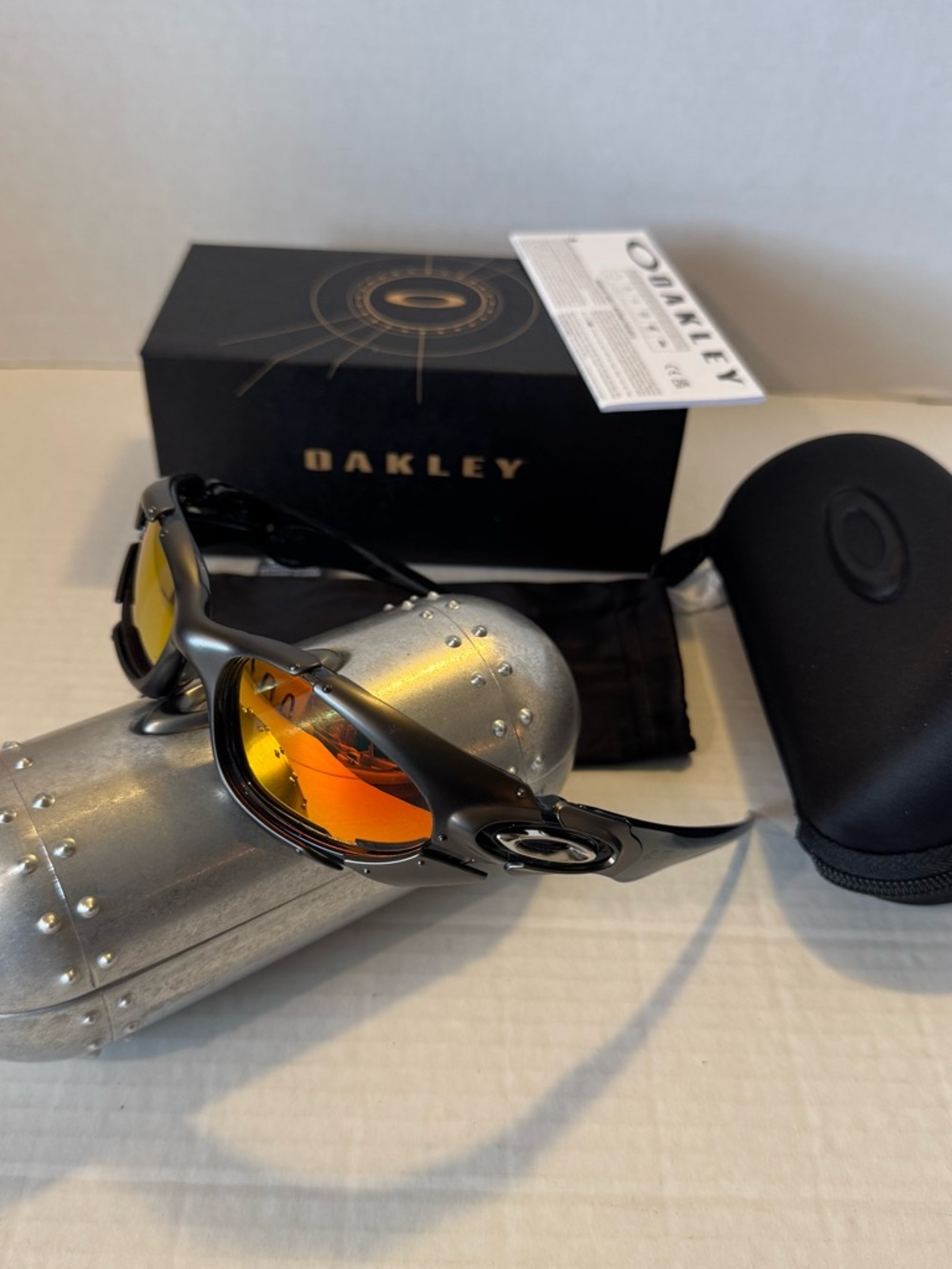 Oakley Black Sunglasses with Orange Mirror Lenses